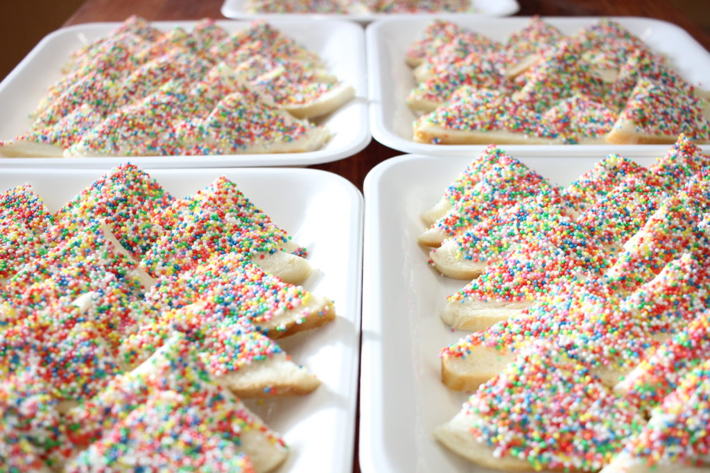 I have learned that every Australian birthday has to have fairy bread. Fairy bread is literally a slice of bread cut into fourths, covered in butter, and then dipped into color-coated sprinkles. So, sugar bread. 