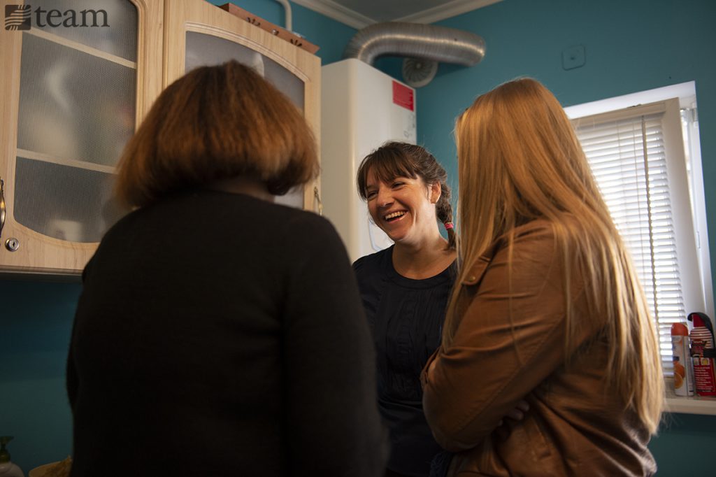 Three women talk