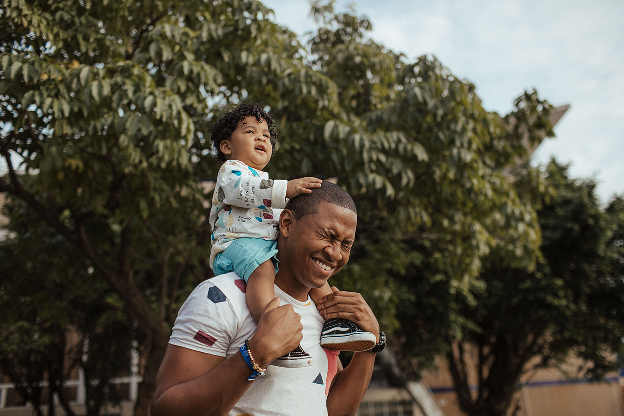 Father with son on shoulders