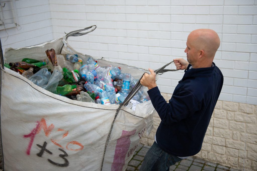 Ukraine man hauling bottles