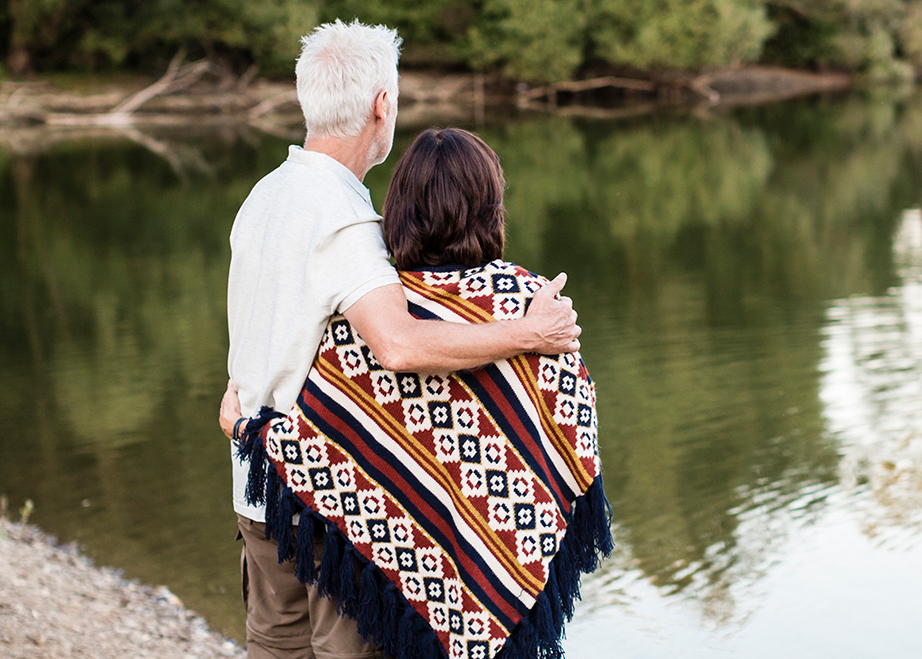 Senior couple overlooking a lake.