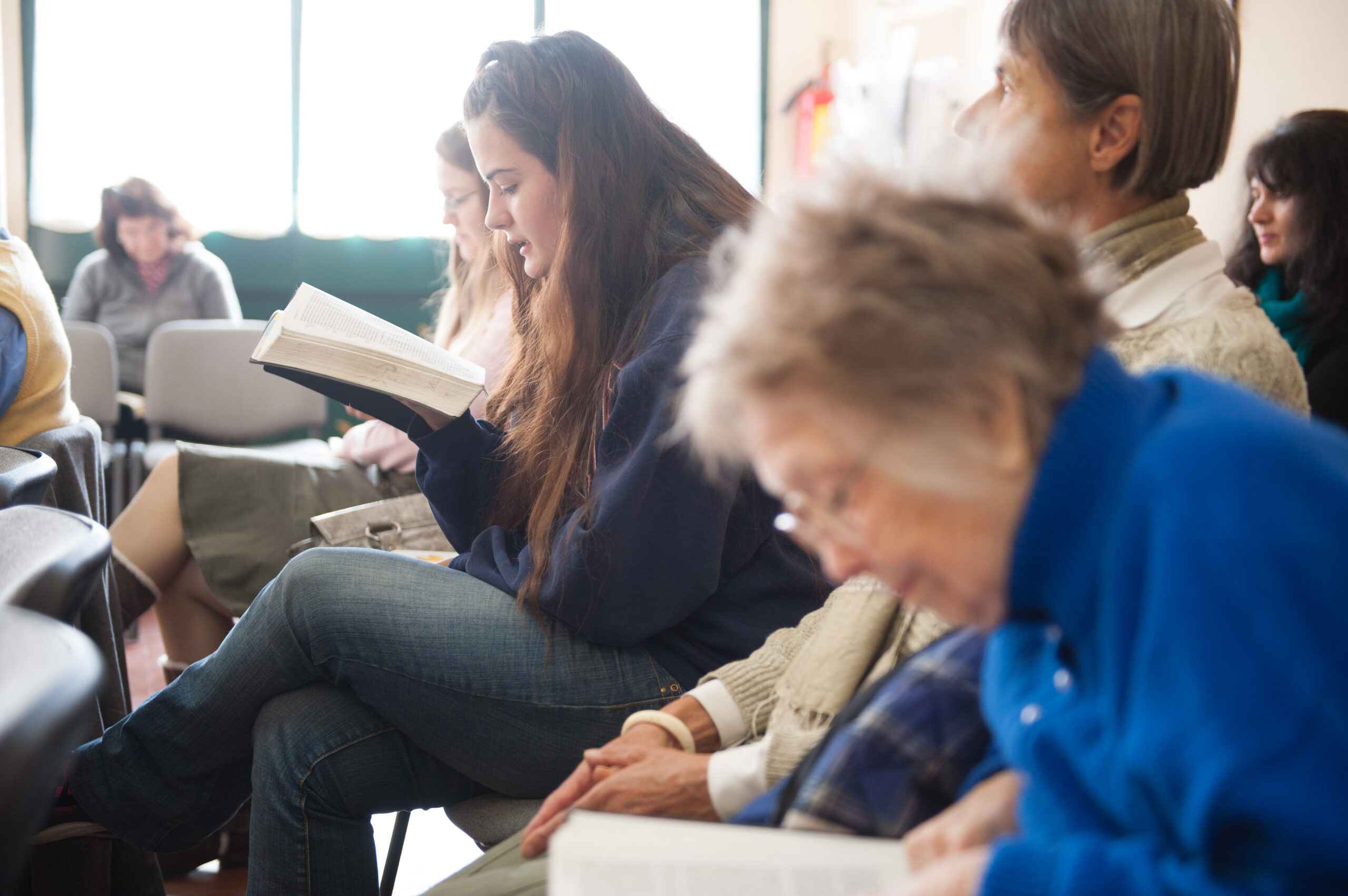 Group reading the Bible in church.