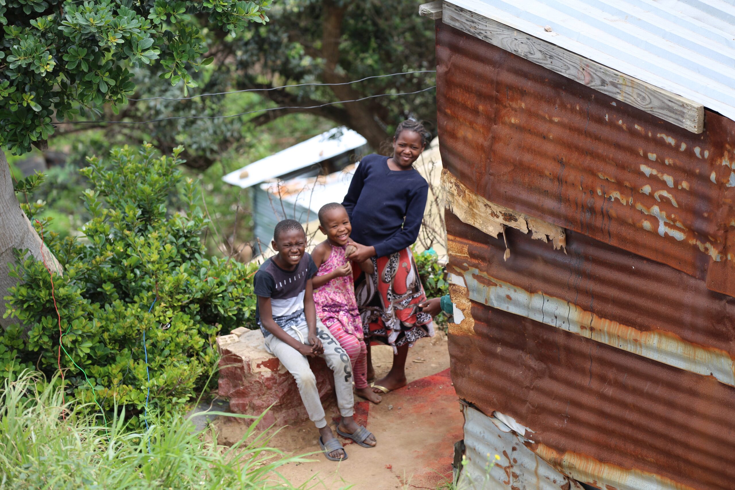 Three children smiling.