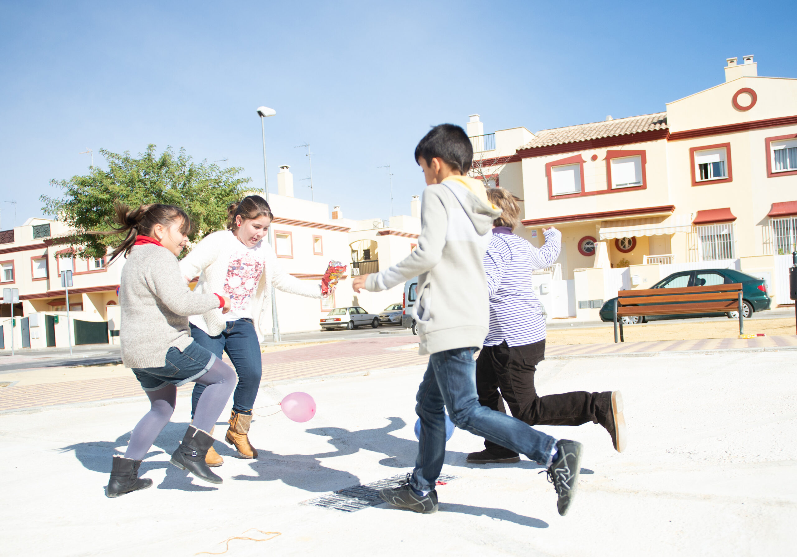 Children kicking balloons.