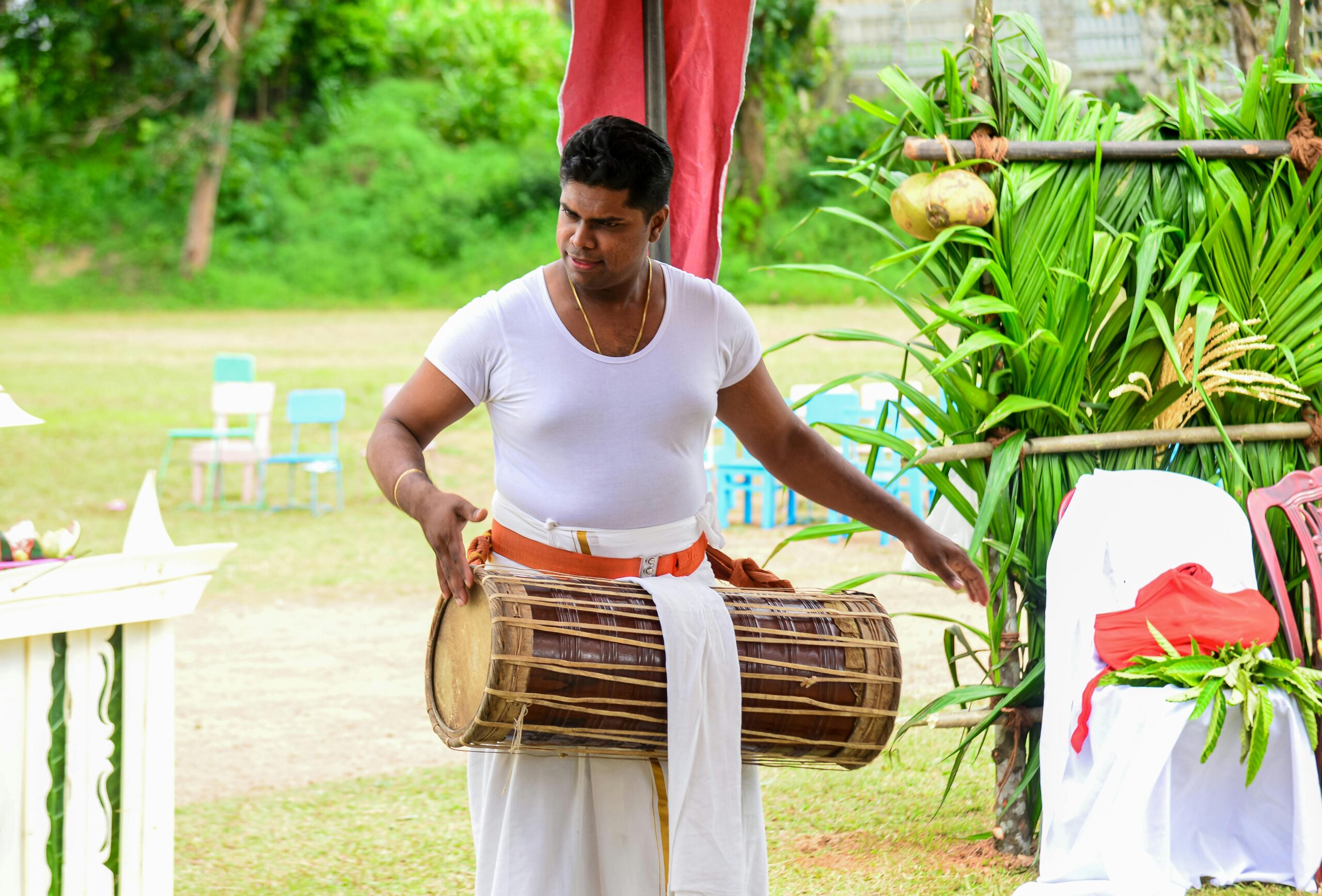 Man beating a drum.