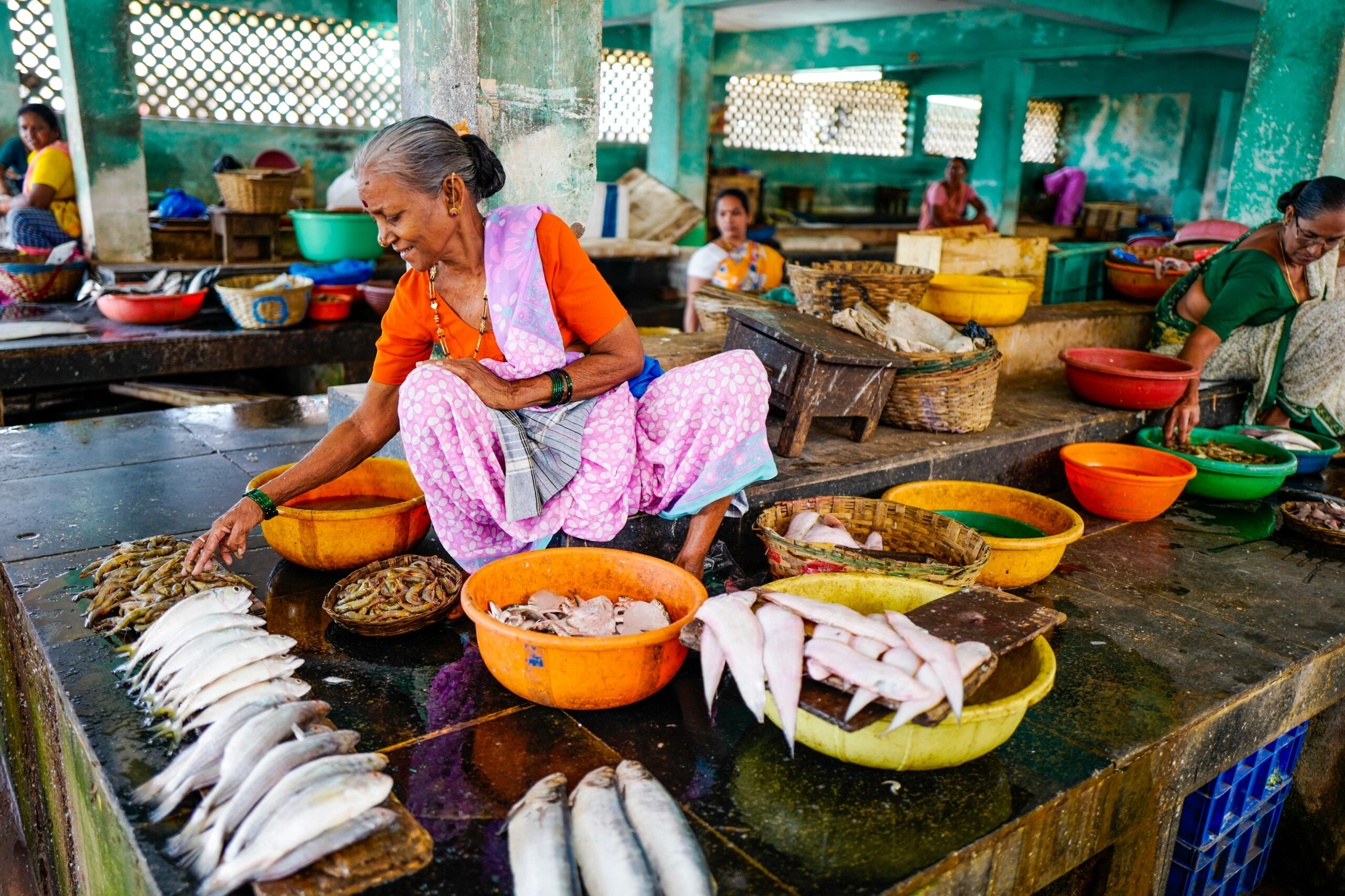 Woman selling fish in the street market.