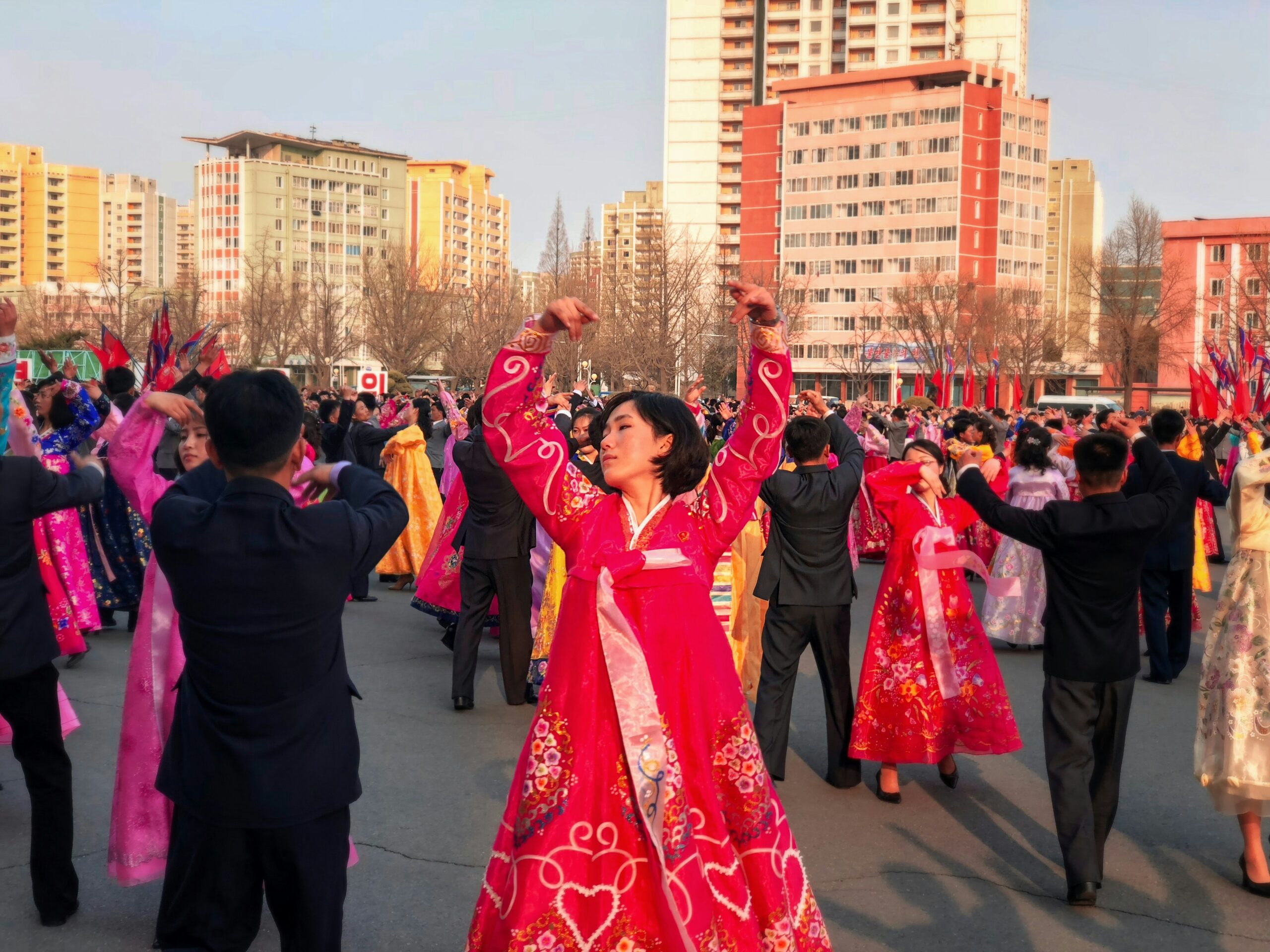 Large crowd doing a cultural dance.