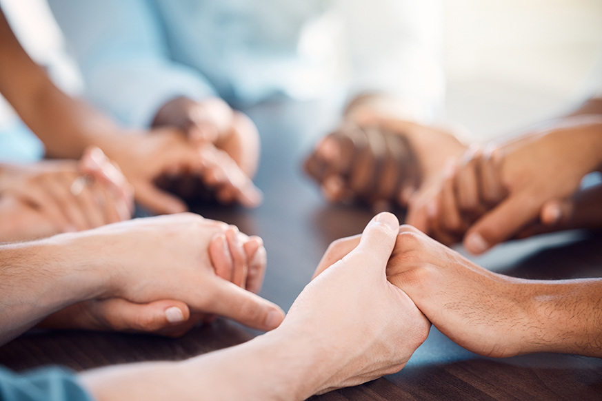 Group holding hands.