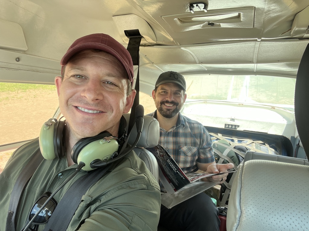 Two men in an airplane.