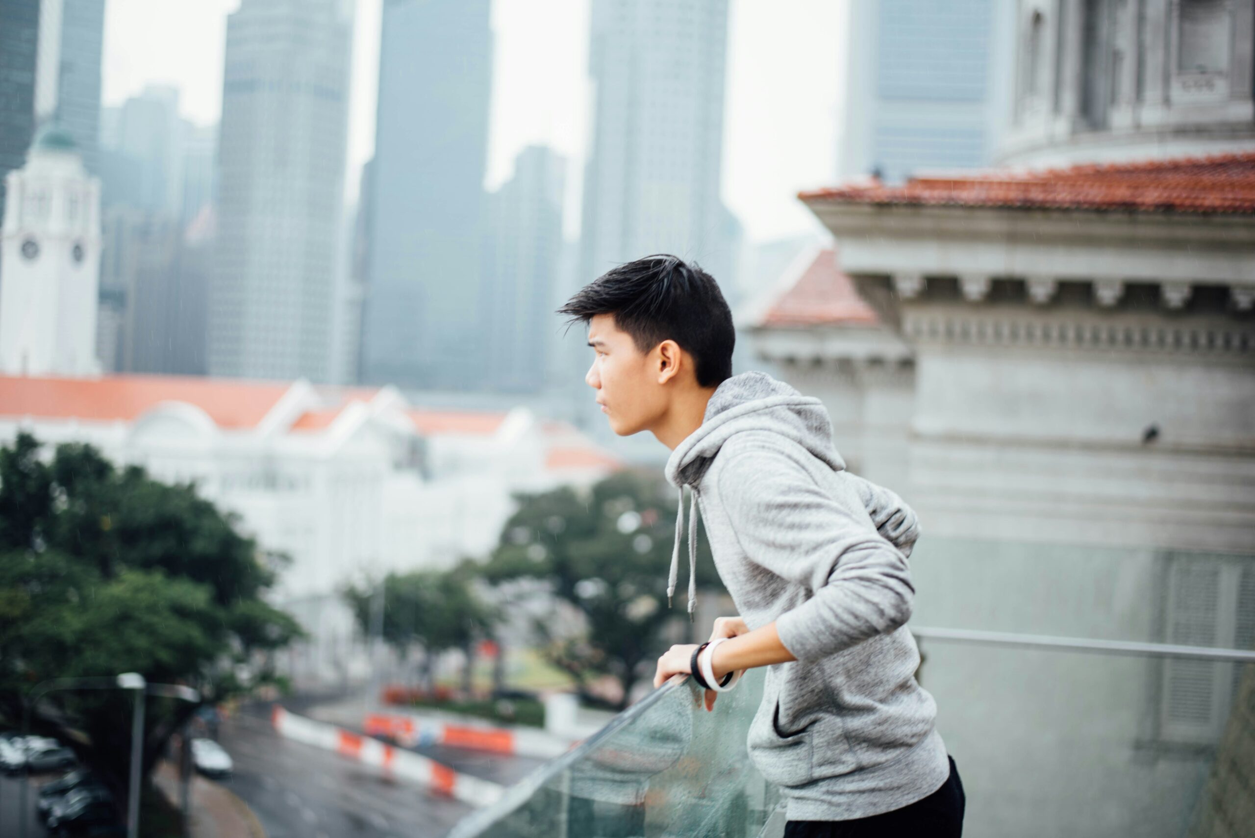 A Japanese boy looks out over the city.