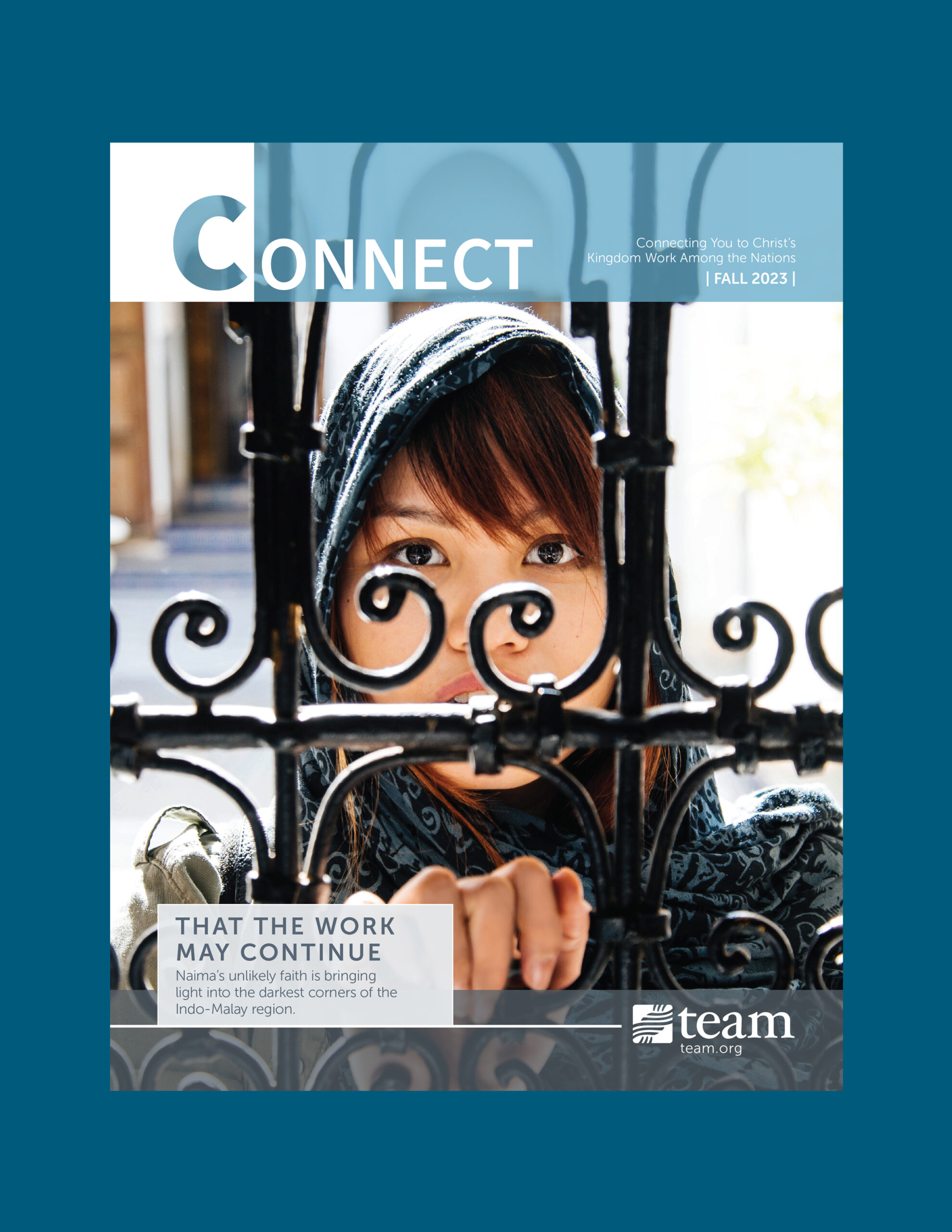 A woman stands behind a gate on the cover of the newsletter.