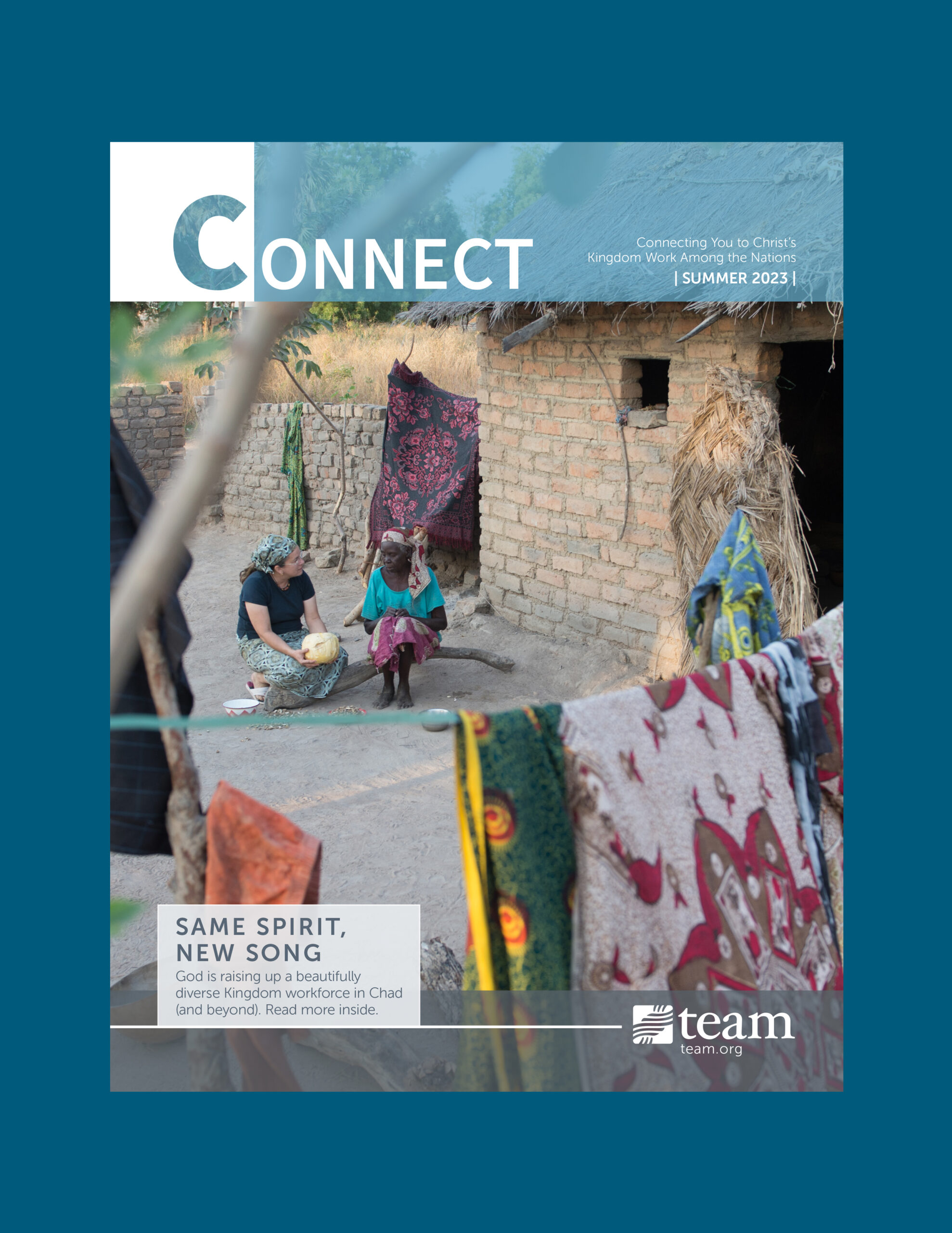 Two women sitting on the ground chatting on the cover of the newsletter.