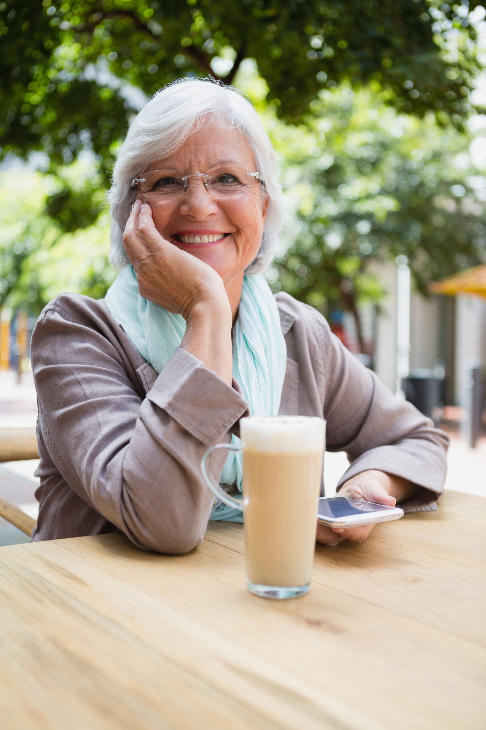 Senior Woman Drinking Iced Coffee.